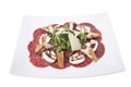 Carpaccio meat with parmesan cheese and arugula