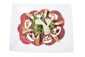 Carpaccio meat with parmesan cheese and arugula