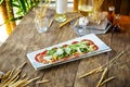 Carpaccio meat with parmesan cheese and arugula