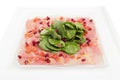 Carpaccio meat with shpinach in a white plate Royalty Free Stock Photo