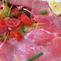 Carpaccio meat and tomatoes