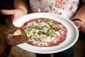 Carpaccio with parmesan, truffles and arugula on a white plate