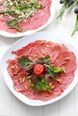 Carpaccio with salad and pine nut