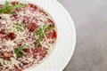 Carpaccio on white plate. Copyspace for text.