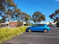 Carpark with blue vehicle during sunlight afternoon Royalty Free Stock Photo