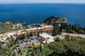 Carpark of Taormina with Isola Bella in the background, view from above, near Taormina, Sicily, Italy