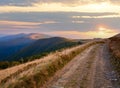 Carpathian Mountains Ukraine autumn landscape with cattle-breeding farm and country road Royalty Free Stock Photo