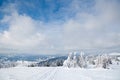 Carpathian mountains, Ukraine. Wonderful snow-covered firs against the backdrop of mountain peaks. Panoramic view of the Royalty Free Stock Photo