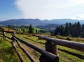 Carpathian. Rolling countryside around a country meadow. Sunny day and Beautiful scene. Gorgeous mountains landscape. Royalty Free Stock Photo