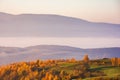 carpathian rural landscape in autumn. foggy weather at sunrise Royalty Free Stock Photo