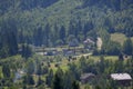 Carpathian village: country houses, gardens, forest and mountains Royalty Free Stock Photo
