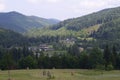 Carpathian village: country houses, gardens, forest and mountains Royalty Free Stock Photo