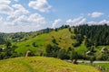 Carpathian village in the valleys with rarely poured down modest houses Royalty Free Stock Photo