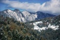 The Carpathians Bucegi Mountains Romania landscape winter snow ice clouds sunlight morning Royalty Free Stock Photo