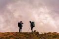 Carpathians, Ukraine August 24, 2020:Tourist couple enjoys the views of the Montenegrin ridge, mountain range, Carpathian Royalty Free Stock Photo