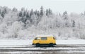 Carpathians, Ukraine - December 2019: Yellow Camper Van With Winter Forest On Background