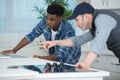 Carpenter and apprentice installing fitted kitchen Royalty Free Stock Photo