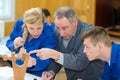 carpenter with apprentice in training period Royalty Free Stock Photo