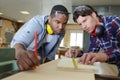 carpenter with apprentice in training period Royalty Free Stock Photo