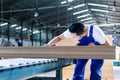 Carpenter in Asian wood workshop working on boards Royalty Free Stock Photo