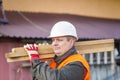 Carpenter with boards