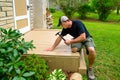 Carpenter Bulding Deck With Hammer Royalty Free Stock Photo