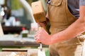 Carpenter with chisel and hammer Royalty Free Stock Photo