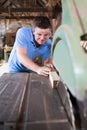 Carpenter Cutting Wood On Circular Saw