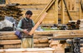 Carpenter cutting wood with professional chop saw Royalty Free Stock Photo