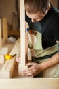 Carpenter does measurements according to project. Woodworker workshop