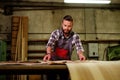 Carpenter doing his job in carpentry workshop Royalty Free Stock Photo