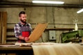 Carpenter doing his job in carpentry workshop Royalty Free Stock Photo