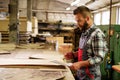 Carpenter doing his job in carpentry workshop Royalty Free Stock Photo