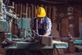 Carpenter doing his job in carpentry workshop. Royalty Free Stock Photo