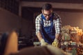 Carpenter doing his job in carpentry workshop Royalty Free Stock Photo