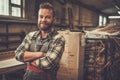 Carpenter doing his work in carpentry workshop. Royalty Free Stock Photo