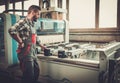 Carpenter doing his work in carpentry workshop. Royalty Free Stock Photo