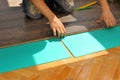 Carpenter doing laminate floor work Royalty Free Stock Photo