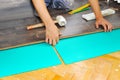 Carpenter doing laminate floor work Royalty Free Stock Photo