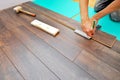 Carpenter doing laminate floor work Royalty Free Stock Photo