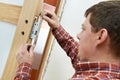 Carpenter at door lock installation