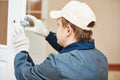 Carpenter at door lock installation Royalty Free Stock Photo