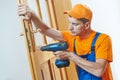 Carpenter at door lock installation or repair Royalty Free Stock Photo