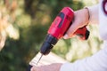 Carpenter drills a hole with an electrical drill Royalty Free Stock Photo