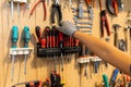 Carpenter getting a tool from his toolbox in a carpentry