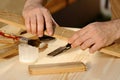 Carpenter gluing pieces of wood together