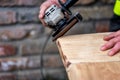 A carpenter works in a garden Royalty Free Stock Photo