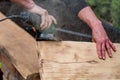 A carpenter works in a garden Royalty Free Stock Photo