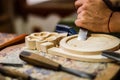 Carpenter hand carving wood with care Royalty Free Stock Photo