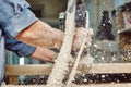 Carpenter with hand electric router machine at work. Milling process of acrylic kitchen countertop Royalty Free Stock Photo